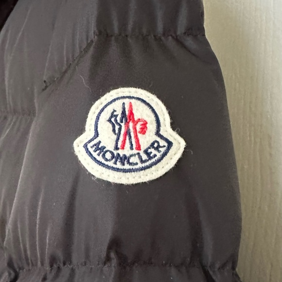 Moncler Classico Puffer Coat. Semi-fitted silhouette and classic puffer design.